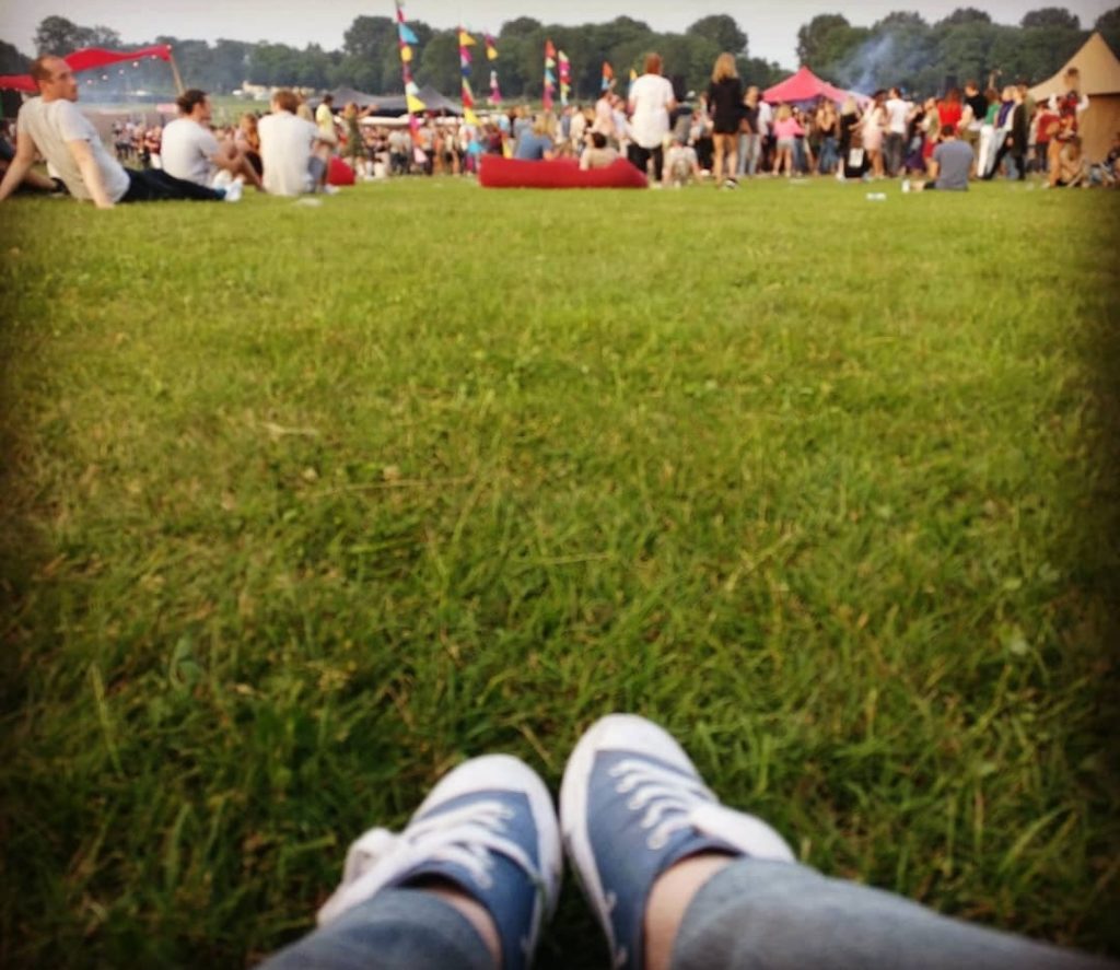 Laying on the grass during a festival